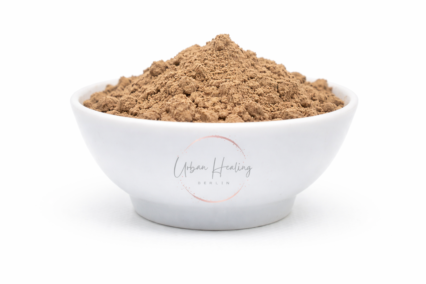 White bowl filled with brown powder on a white background, featuring 'Urban Healing' branding.